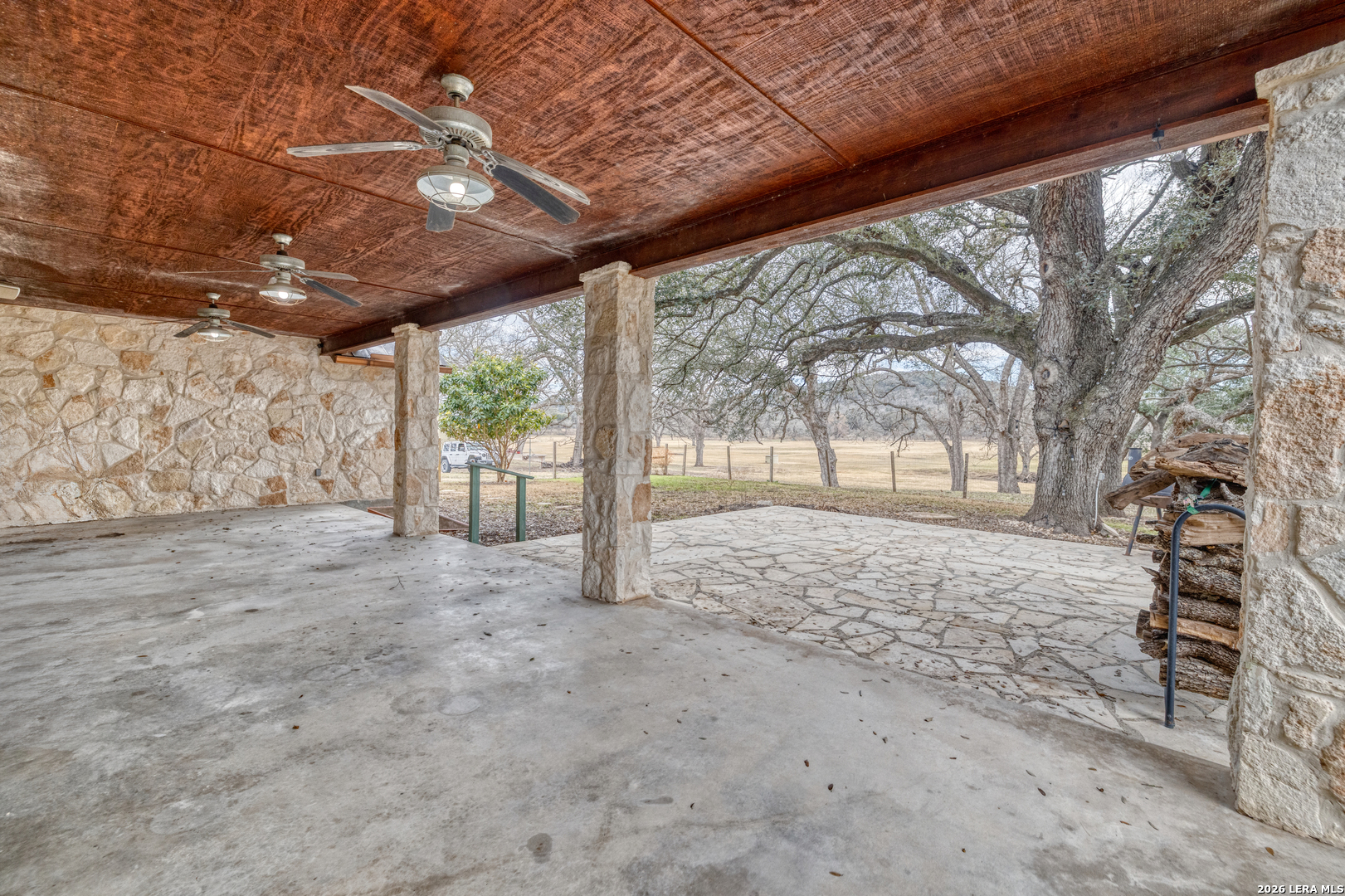 498 Camino Del Rancho Concan, TX 78838 - Photo 34 of 49 a view of a yard with wooden fence