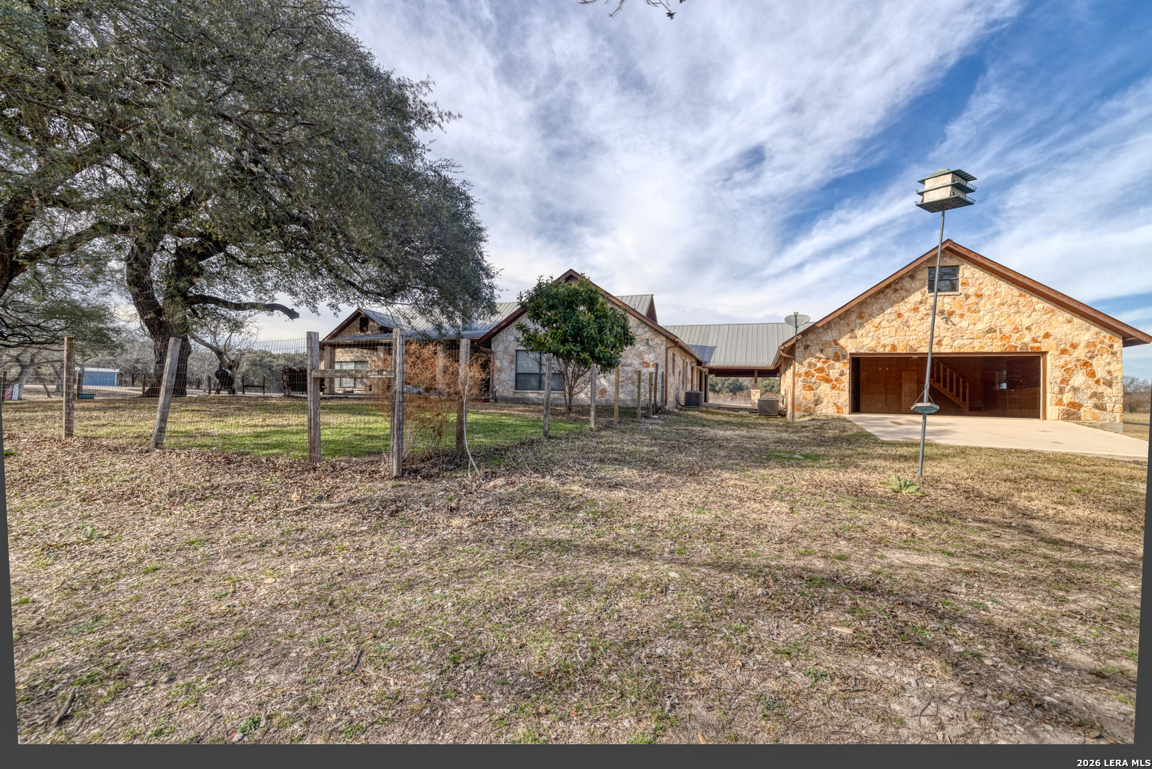 498 Camino Del Rancho Concan, TX 78838 - Photo 45 of 49 a front view of a house with garden