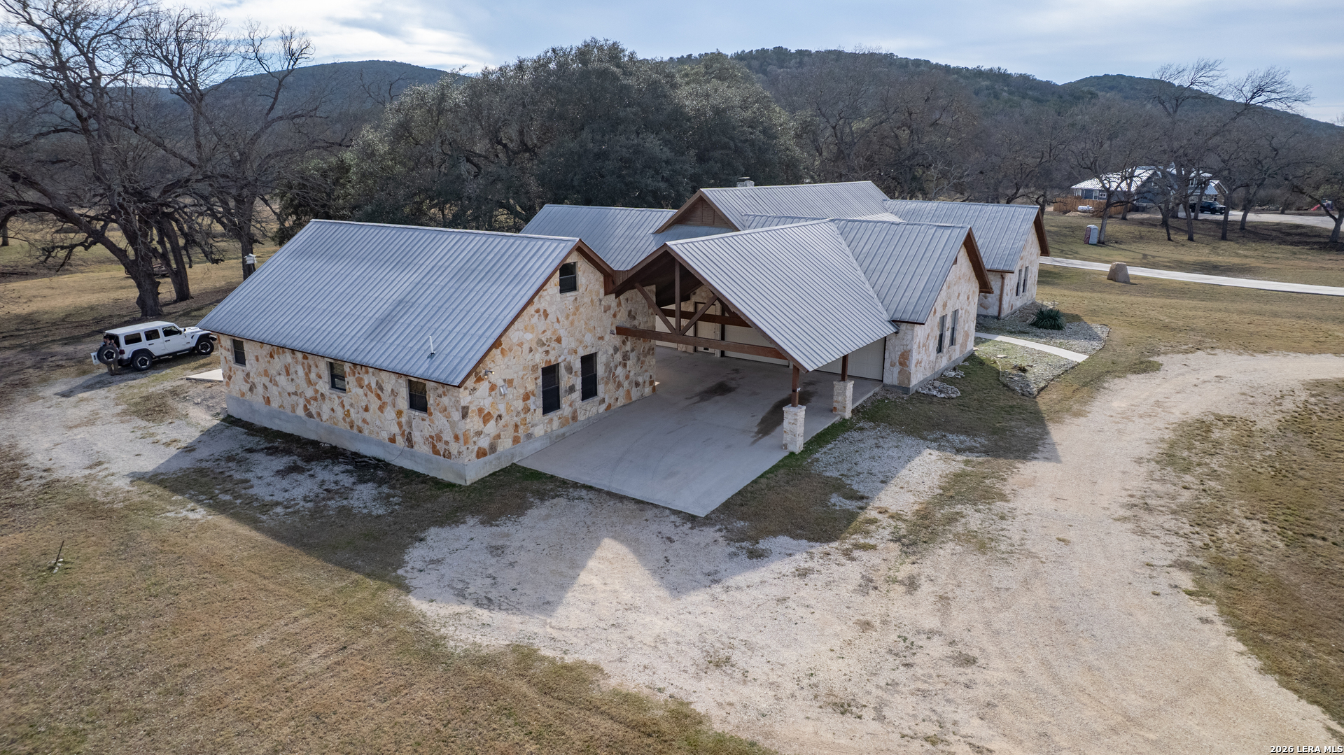 498 Camino Del Rancho Concan, TX 78838 - Photo 5 of 49 a view of houses with a yard and mountain view
