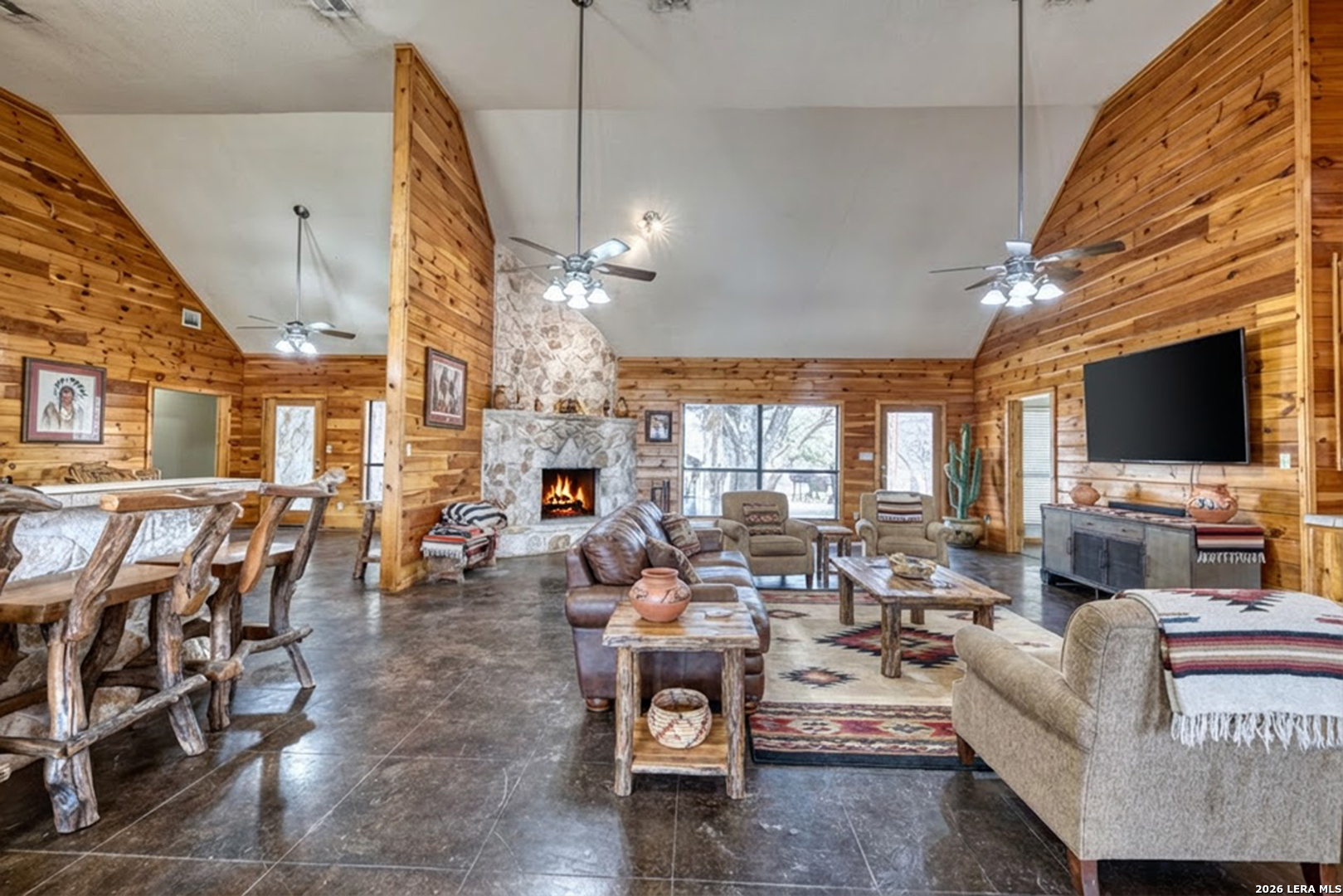 498 Camino Del Rancho Concan, TX 78838 - Photo 10 of 49 a living room with furniture and a flat screen tv