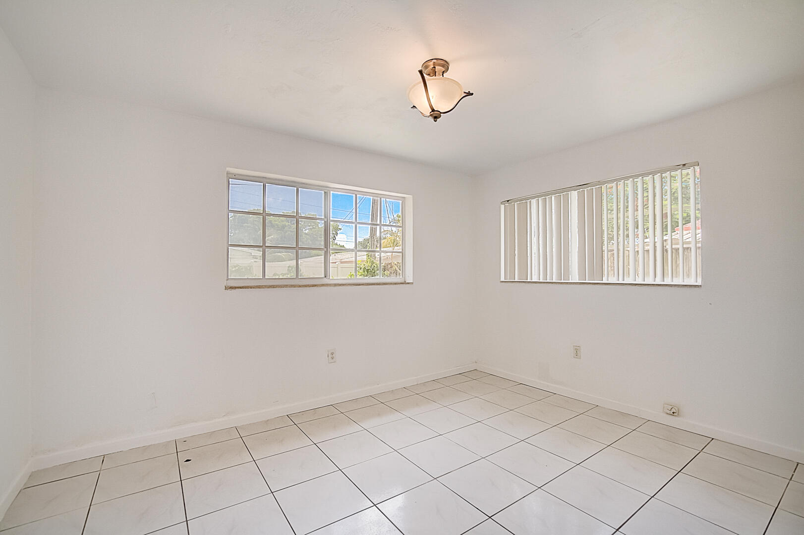 2813 Southwest 68th Terrace Miramar, FL 33023 - Photo 15 of 29 a view of an empty room with a window