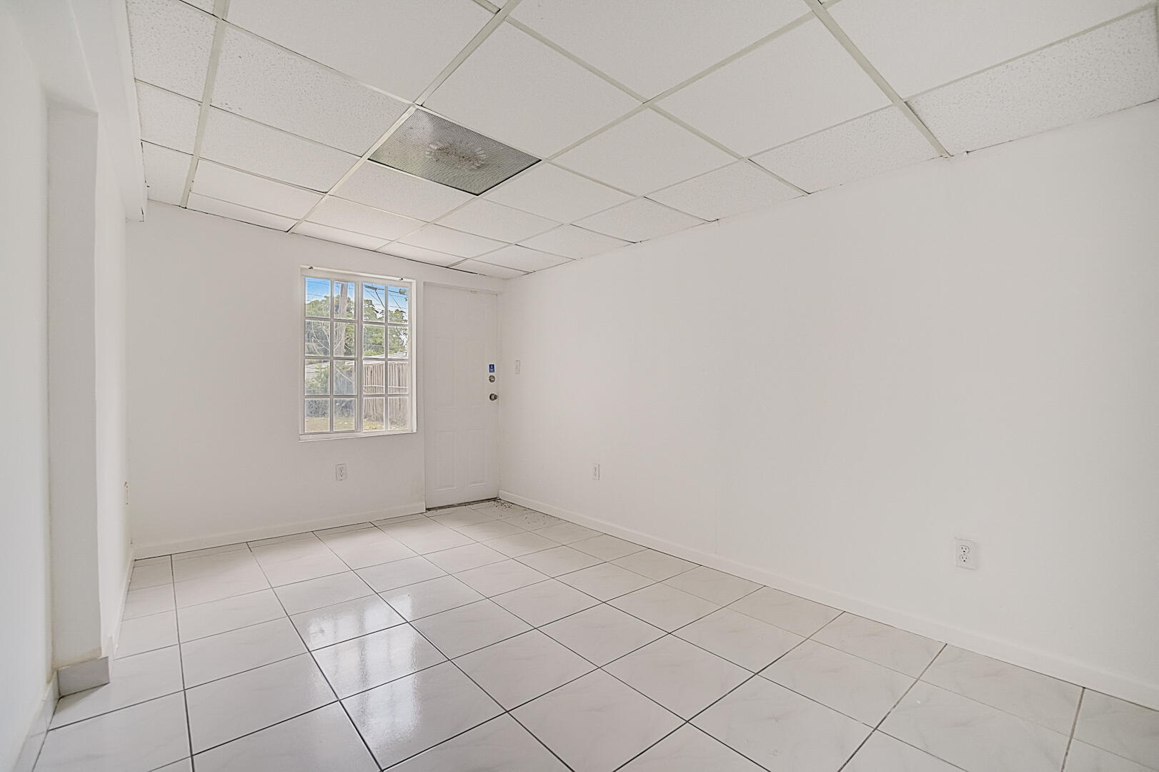 2813 Southwest 68th Terrace Miramar, FL 33023 - Photo 16 of 29 an empty room with windows