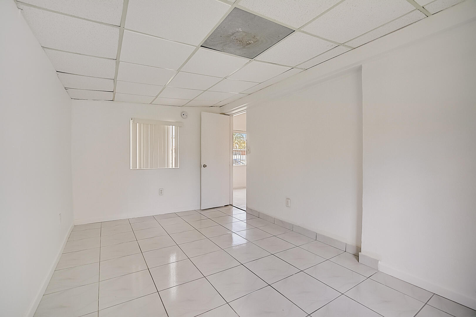 2813 Southwest 68th Terrace Miramar, FL 33023 - Photo 17 of 29 a view of an empty room with windows