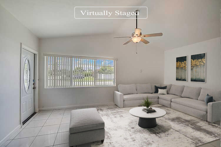 2813 Southwest 68th Terrace Miramar, FL 33023 - Photo 2 of 29 a living room with furniture and a window