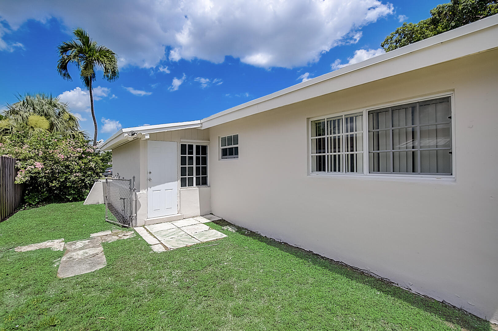 2813 Southwest 68th Terrace Miramar, FL 33023 - Photo 25 of 29 a view of a backyard with a potted plant and a large tree