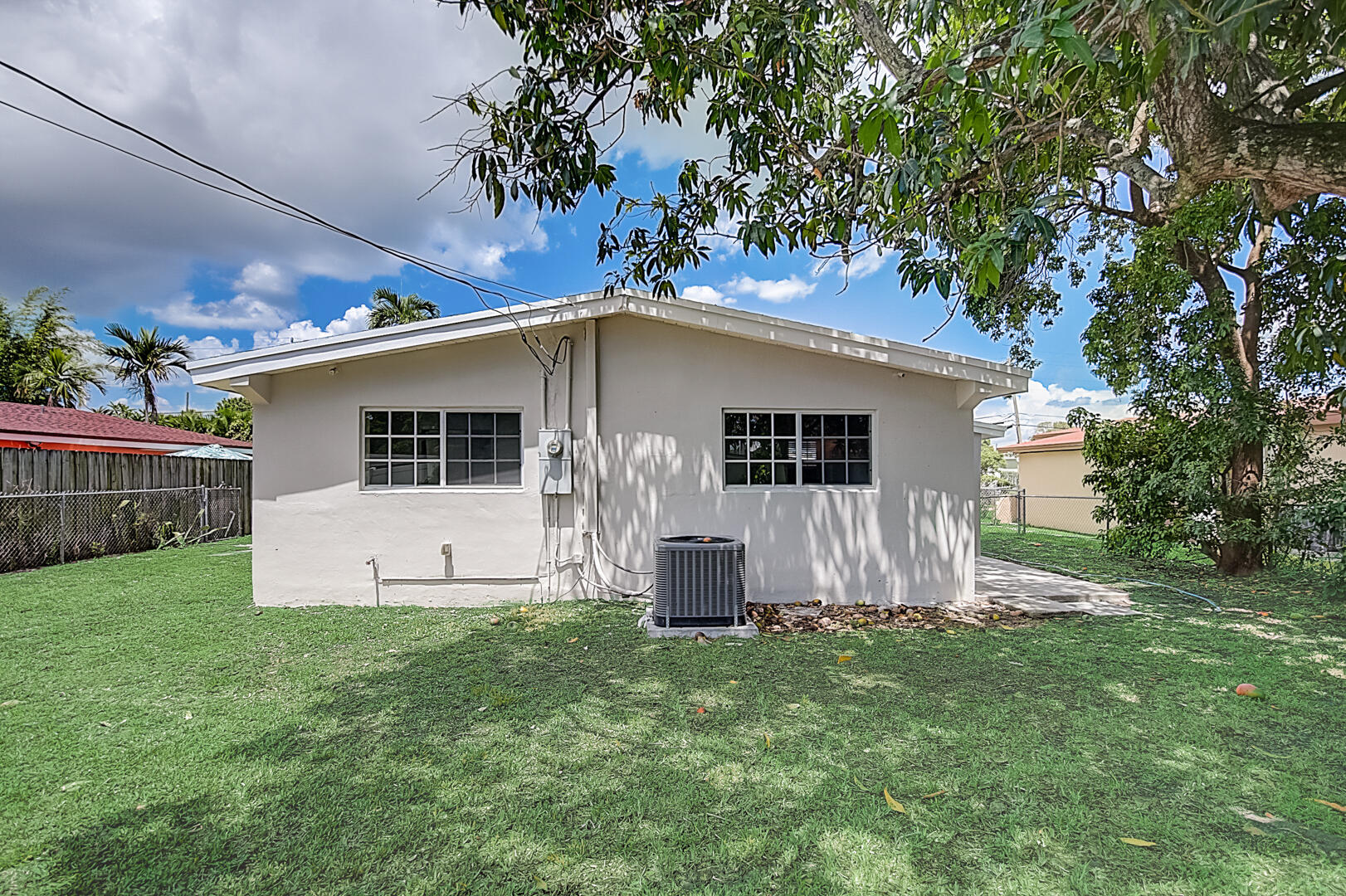 2813 Southwest 68th Terrace Miramar, FL 33023 - Photo 27 of 29 a view of a backyard with potted plants and large tree