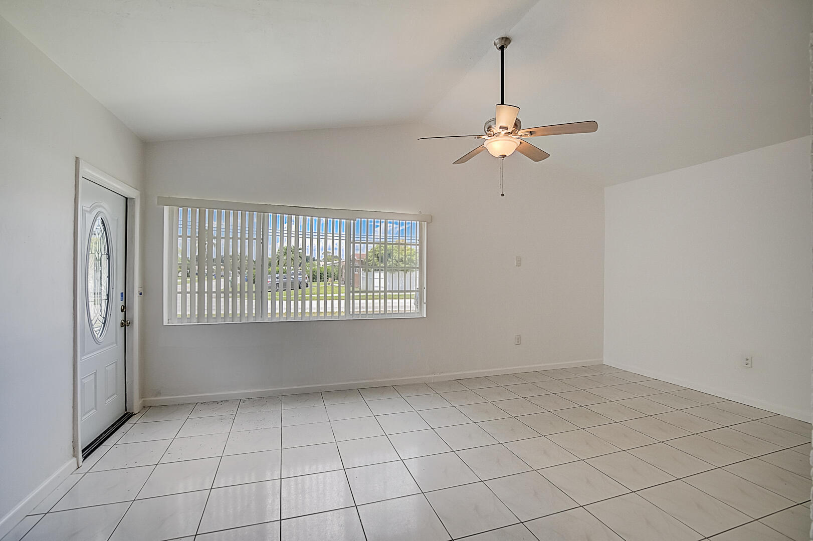 2813 Southwest 68th Terrace Miramar, FL 33023 - Photo 9 of 29 an empty room with windows and fan