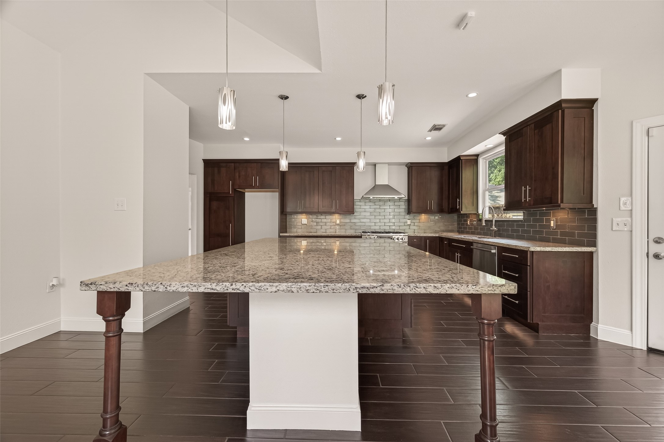 6131 Hampton Way Court Spring, TX 77389 - Photo 16 of 50 a kitchen with stainless steel appliances granite countertop a sink a stove and a microwave