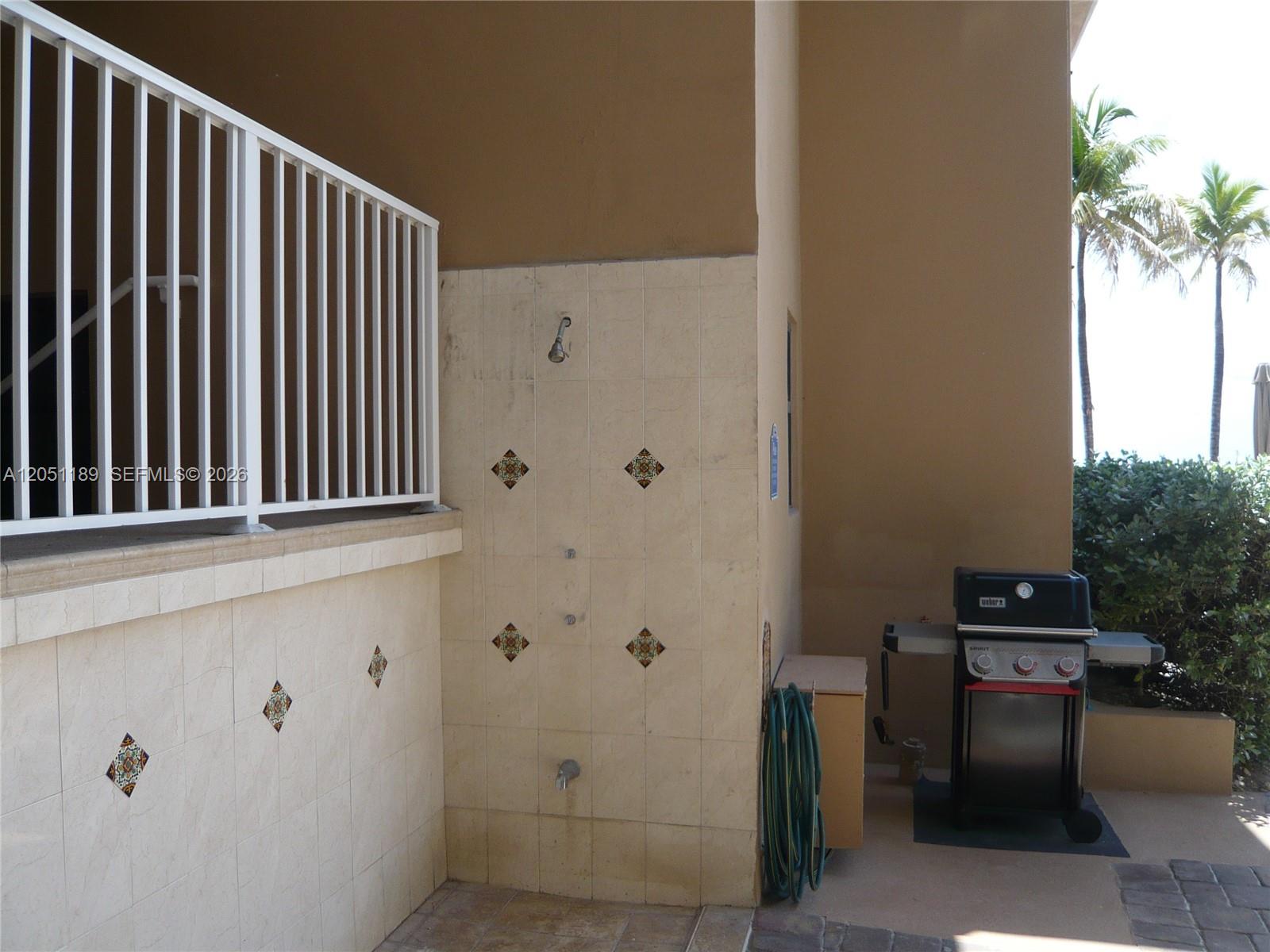3300 North Surf Road, Unit 9A Hollywood, FL 33019 - Photo 14 of 16 OUTSIDE SHOWER AND BARBEQUE