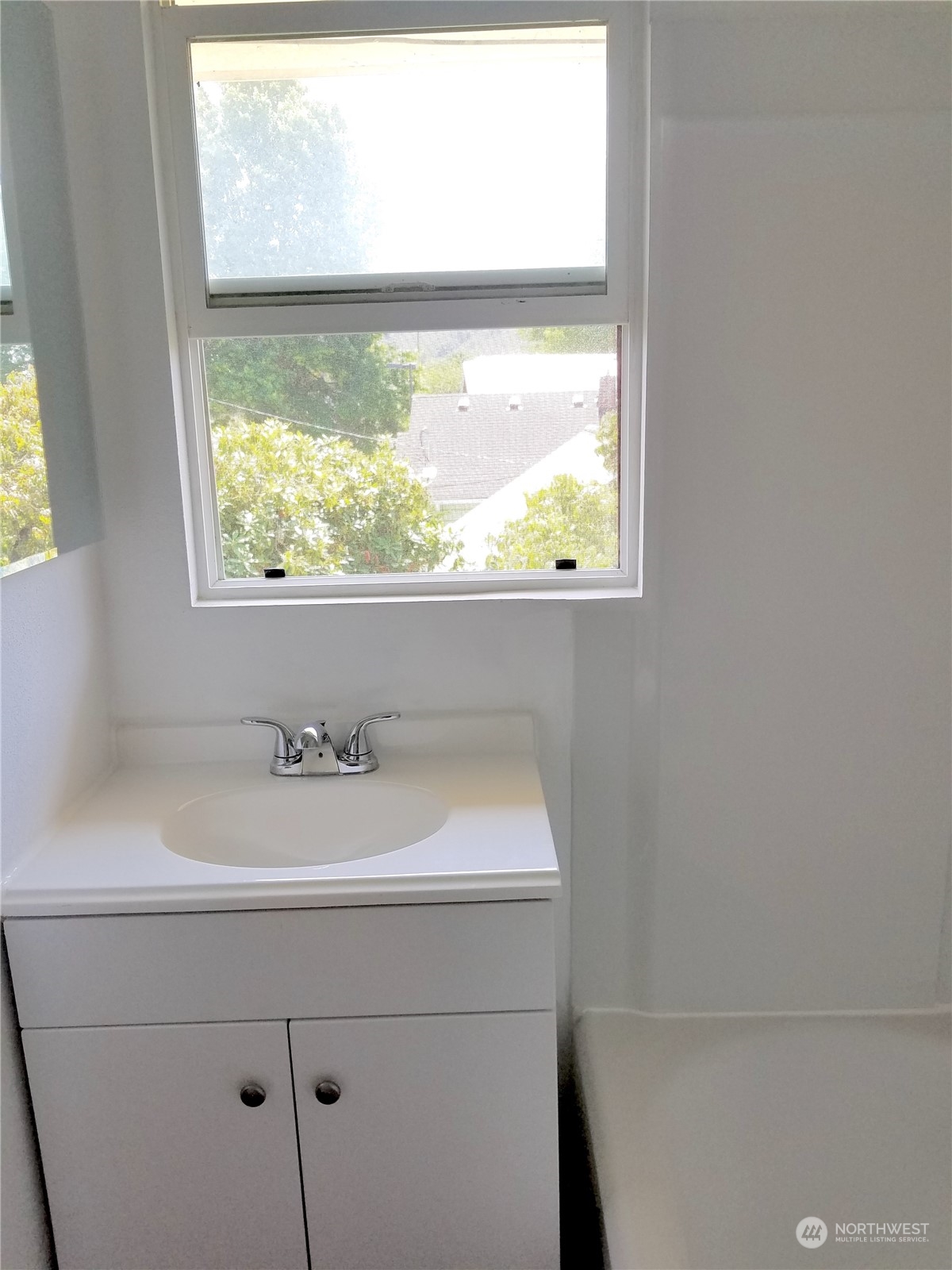 123 Factory Avenue North Renton, WA 98057 - Photo 18 of 19 a bathroom with a sink and a window