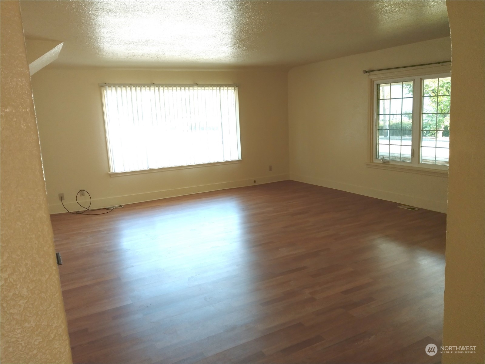123 Factory Avenue North Renton, WA 98057 - Photo 8 of 19 an empty room with wooden floor and windows