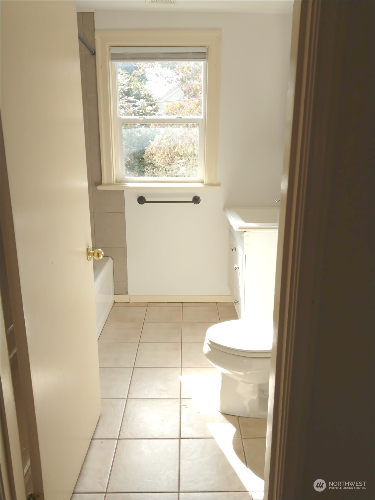 123 Factory Avenue North Renton, WA 98057 - Photo 9 of 19 a bathroom with a sink a toilet and a window