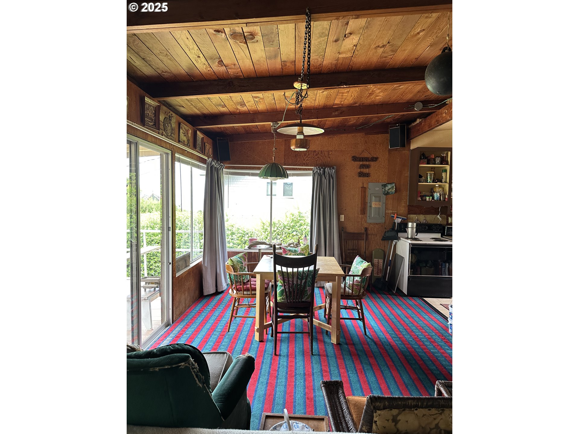 37365 4th Street Nehalem, OR 97131 - Photo 11 of 27 a view of a dining room with furniture and window