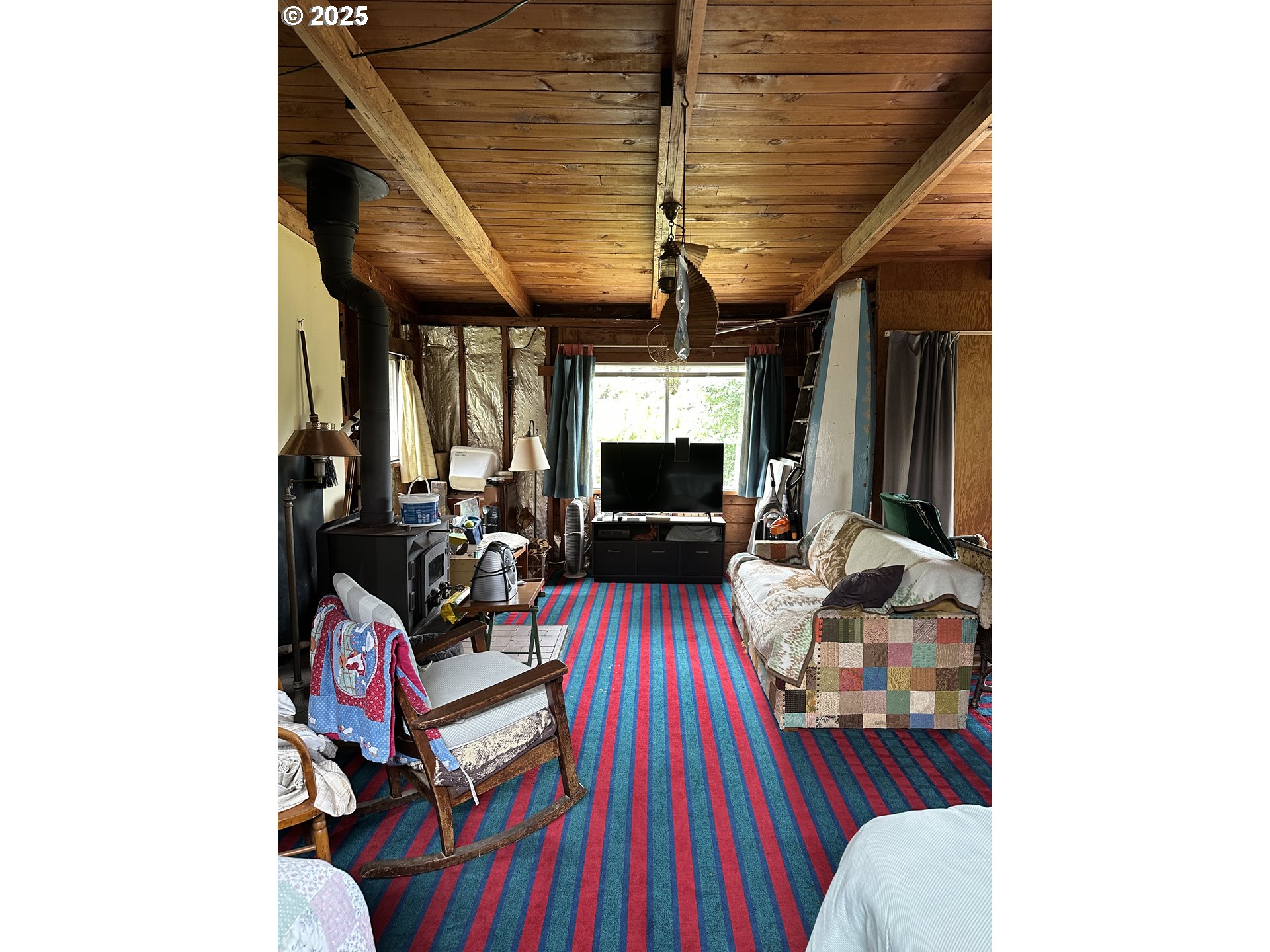 37365 4th Street Nehalem, OR 97131 - Photo 12 of 27 a living room with furniture and a flat screen tv