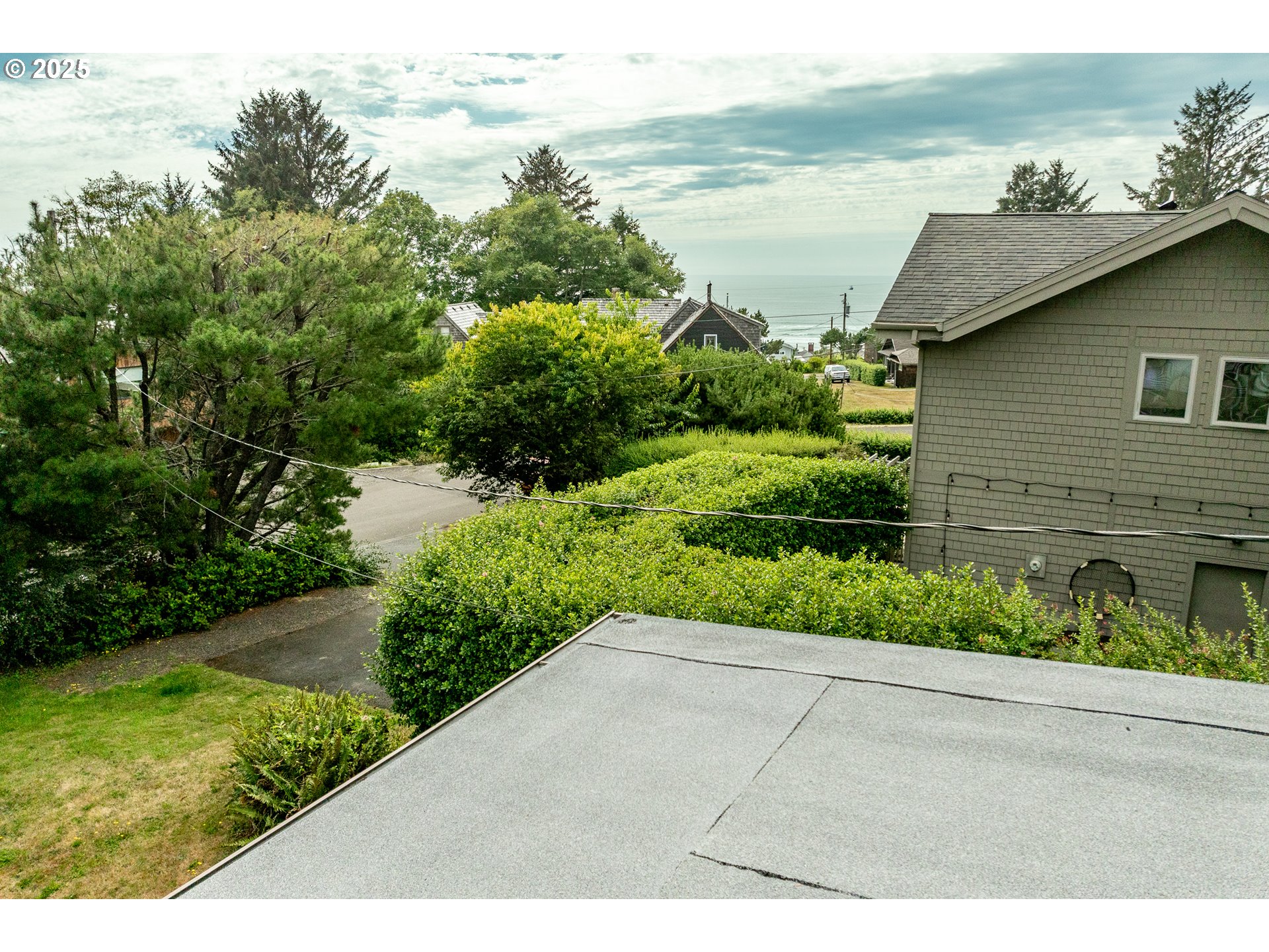 37365 4th Street Nehalem, OR 97131 - Photo 16 of 27 a view of a garden with an ocean view