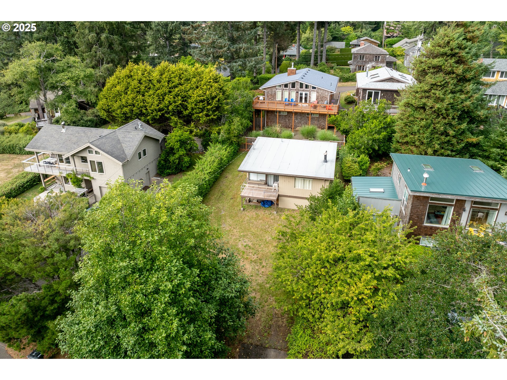 37365 4th Street Nehalem, OR 97131 - Photo 20 of 27 a aerial view of a house with garden space and street view
