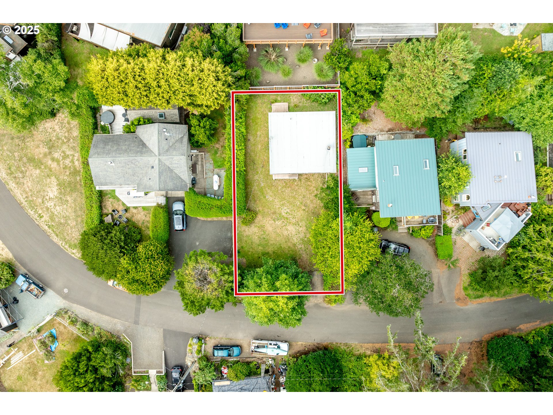 37365 4th Street Nehalem, OR 97131 - Photo 23 of 27 an aerial view of a house with a yard basket ball court and outdoor seating