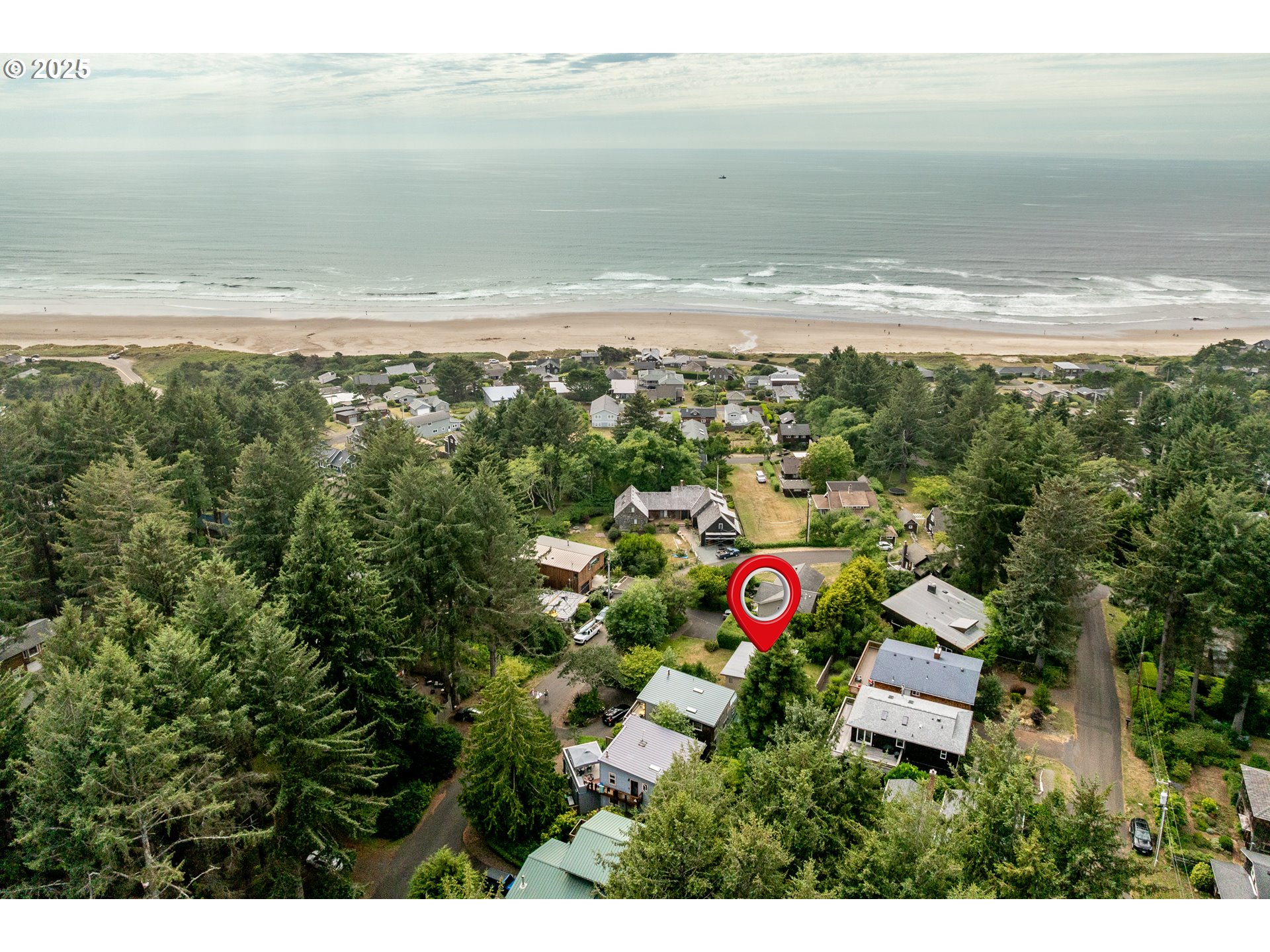 37365 4th Street Nehalem, OR 97131 - Photo 26 of 27 a view of an ocean and a mountain