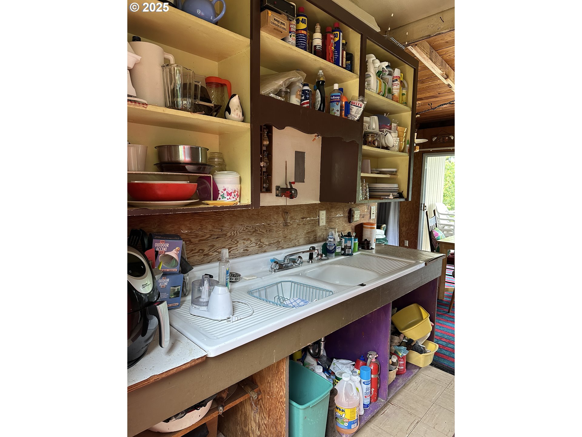 37365 4th Street Nehalem, OR 97131 - Photo 5 of 27 a utility room with lots of clutter and cabinets