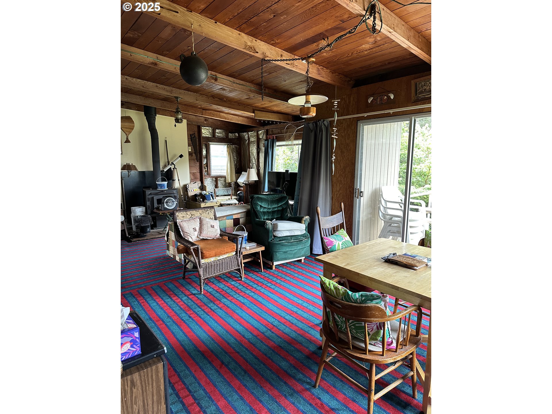 37365 4th Street Nehalem, OR 97131 - Photo 7 of 27 a living room with furniture and a window