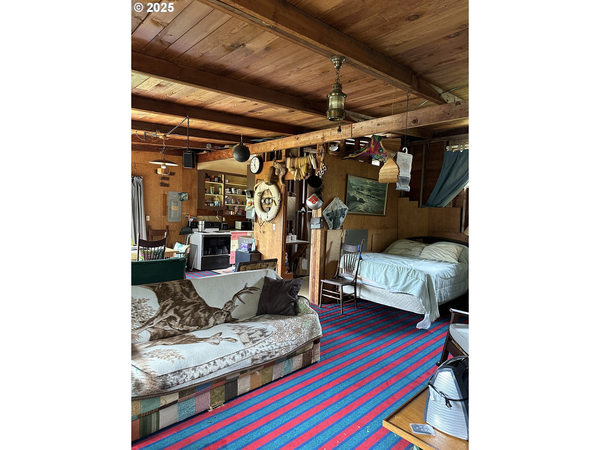 37365 4th Street Nehalem, OR 97131 - Photo 9 of 27 a living room with furniture and a rug