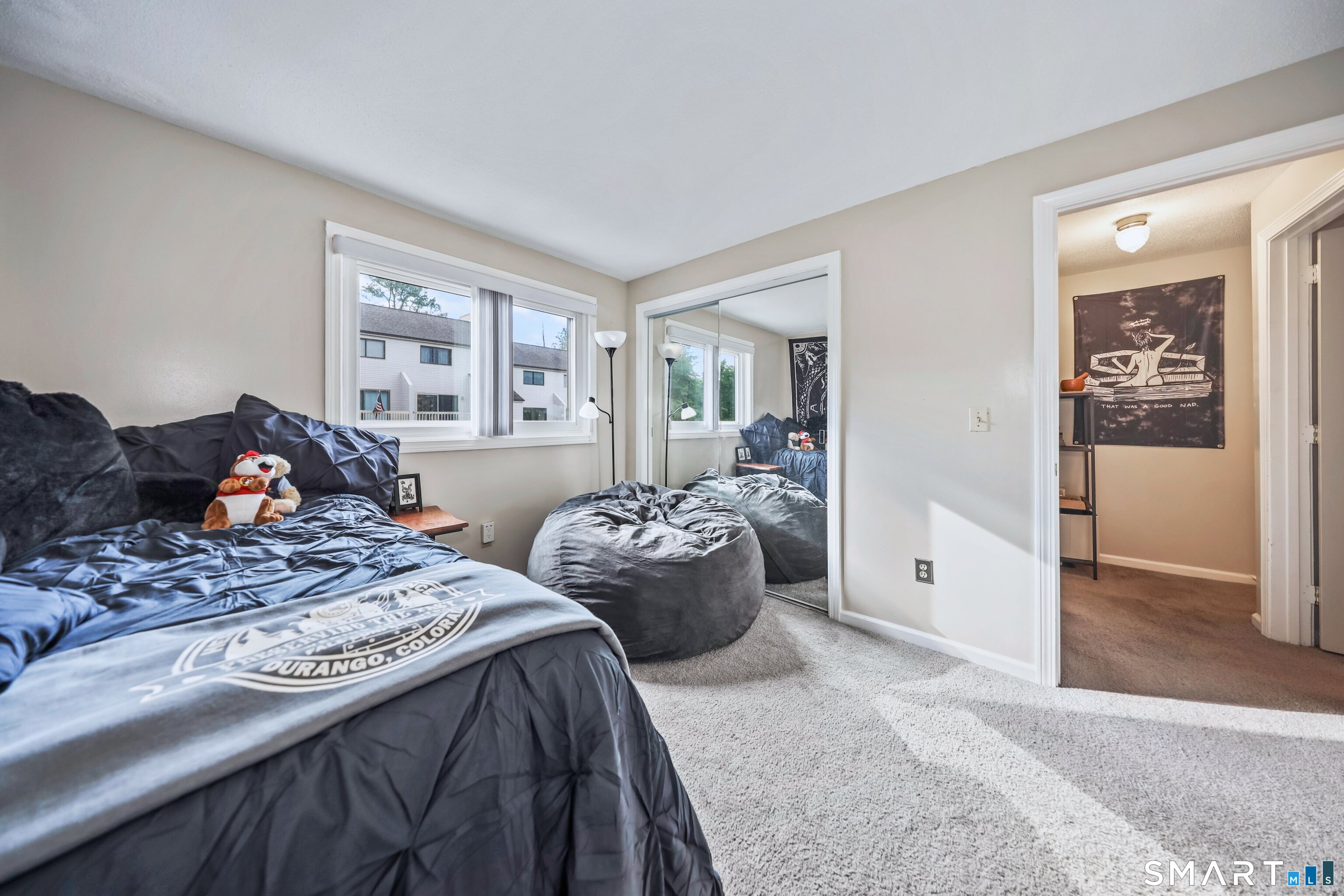349 Allen Road, Unit 34C Torrington, CT 06790 - Photo 16 of 31 a bedroom with two beds and wooden floor
