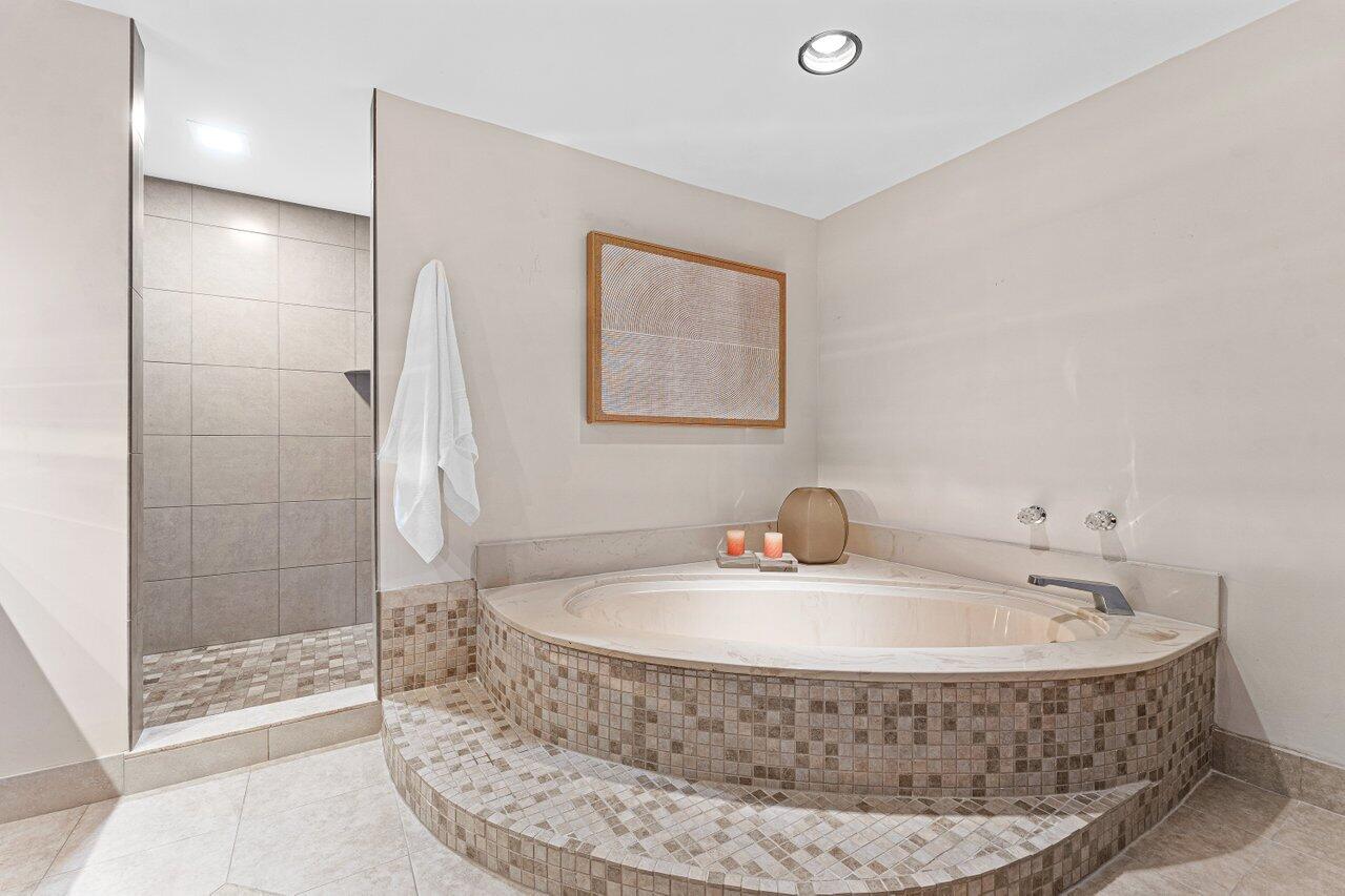 2003 North Ocean Boulevard, Unit 902 Boca Raton, FL 33431 - Photo 22 of 45 a bathroom with a sink and a mirror