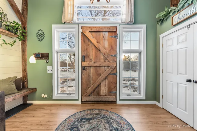 a bedroom with a bed and a large mirror with a flat tv screen