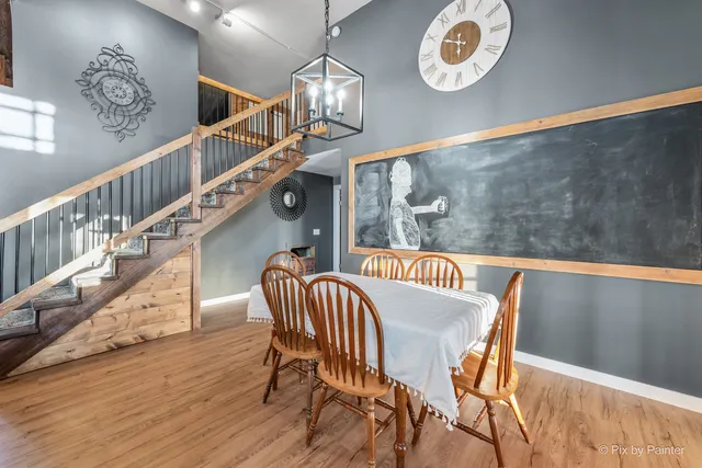 a bedroom with furniture and a wooden floor