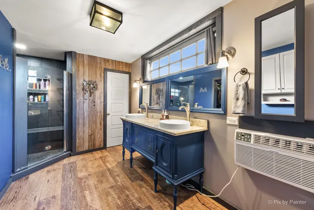 a picture of a bench in front of a wall