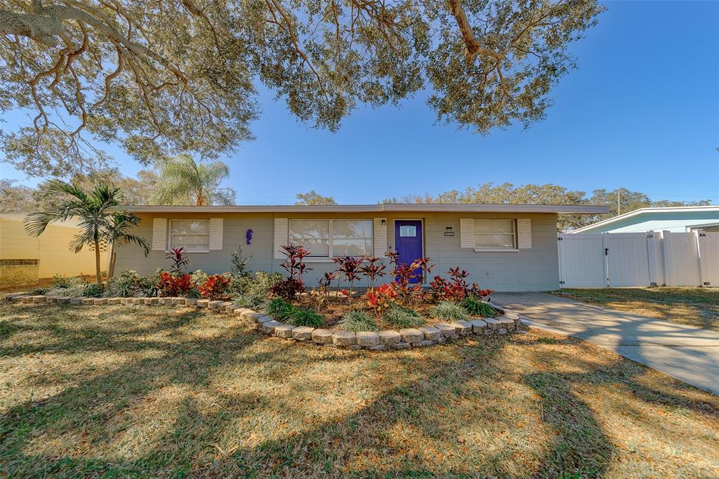 11128 116th Street Largo, FL 33778 - Photo 1 of 50 a view of a house with patio