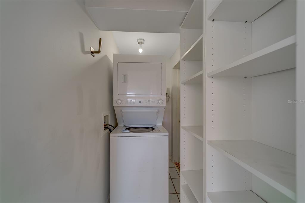 11128 116th Street Largo, FL 33778 - Photo 21 of 50 a view of walk in closet with empty racks