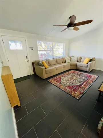 a living room with a rug and a rug