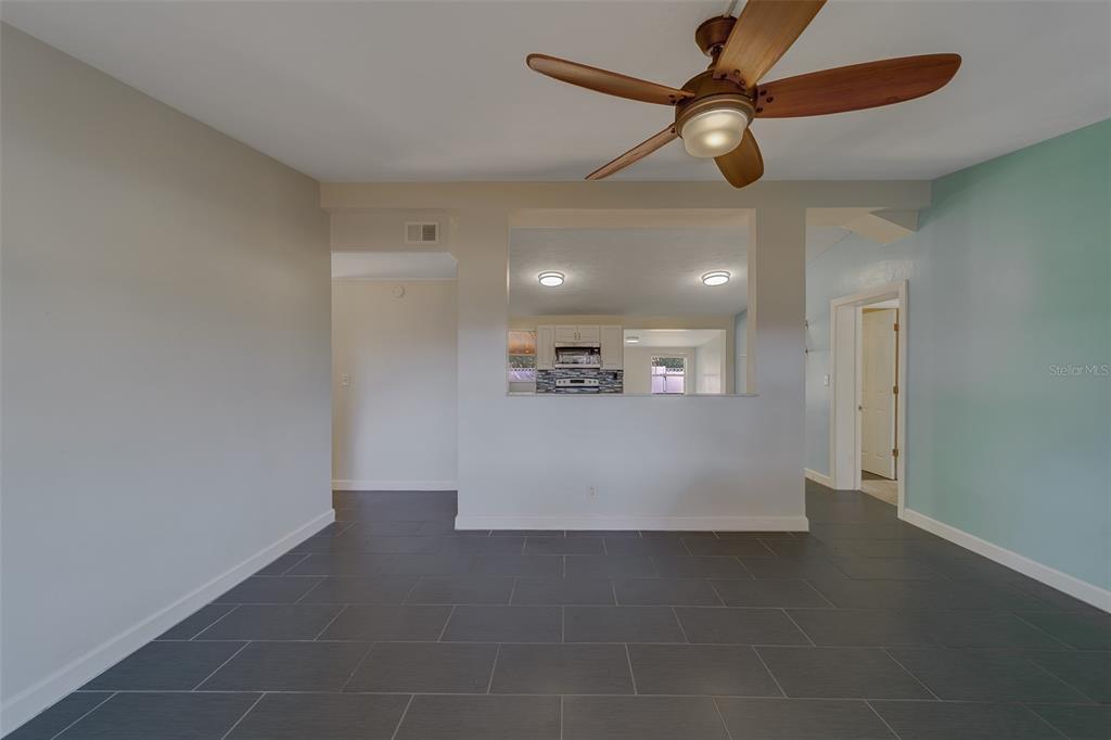 11128 116th Street Largo, FL 33778 - Photo 4 of 50 a view of a hallway with a ceiling fan