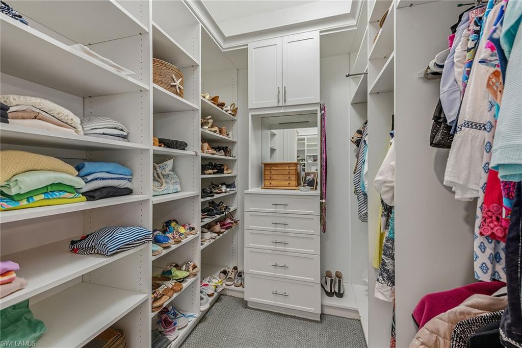 14685 Kelson Circle Naples, FL 34114 - Photo 11 of 50 a view of walk in closet with clothes and shoes
