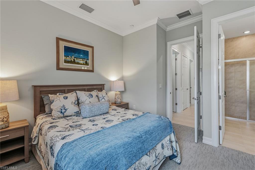 14685 Kelson Circle Naples, FL 34114 - Photo 14 of 50 a bedroom with a bed and a mirror