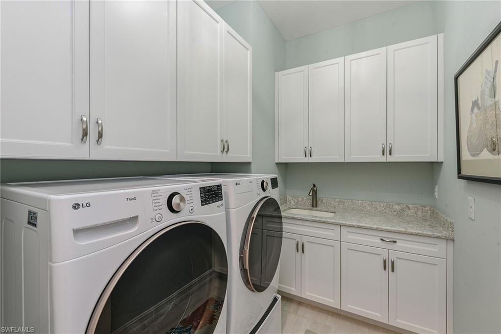 14685 Kelson Circle Naples, FL 34114 - Photo 19 of 50 a utility room with dryer and washer