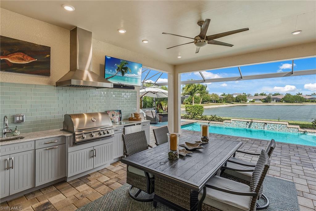 14685 Kelson Circle Naples, FL 34114 - Photo 20 of 50 a kitchen with a stove a sink and a refrigerator