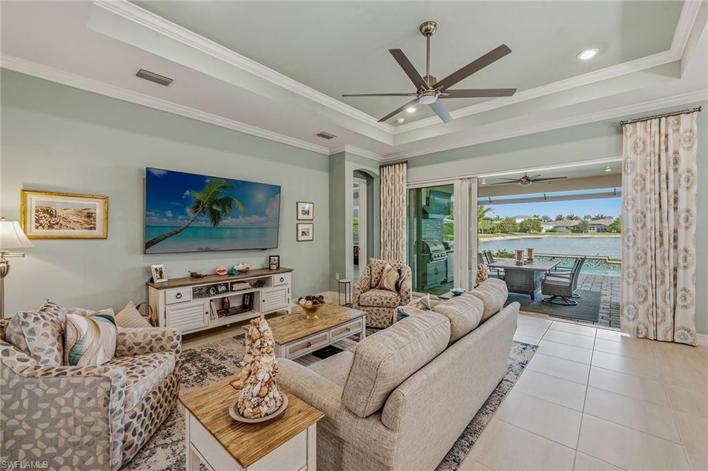 14685 Kelson Circle Naples, FL 34114 - Photo 2 of 50 a living room with furniture a large window with outer view
