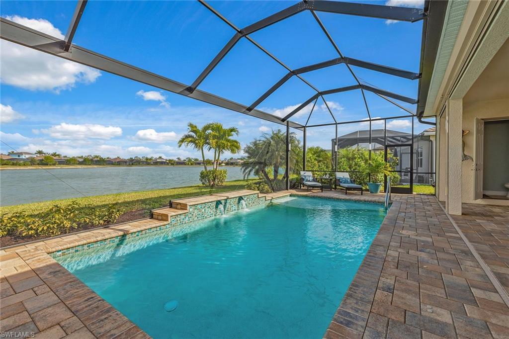 14685 Kelson Circle Naples, FL 34114 - Photo 22 of 50 a view of a swimming pool with a patio