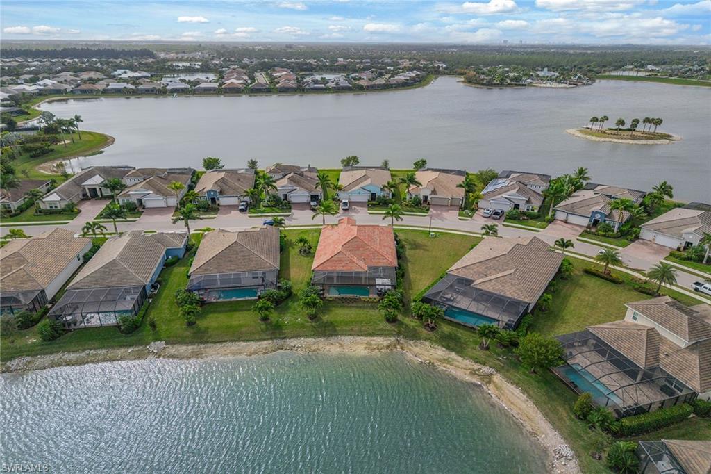 14685 Kelson Circle Naples, FL 34114 - Photo 30 of 50 an aerial view of a house with a lake view