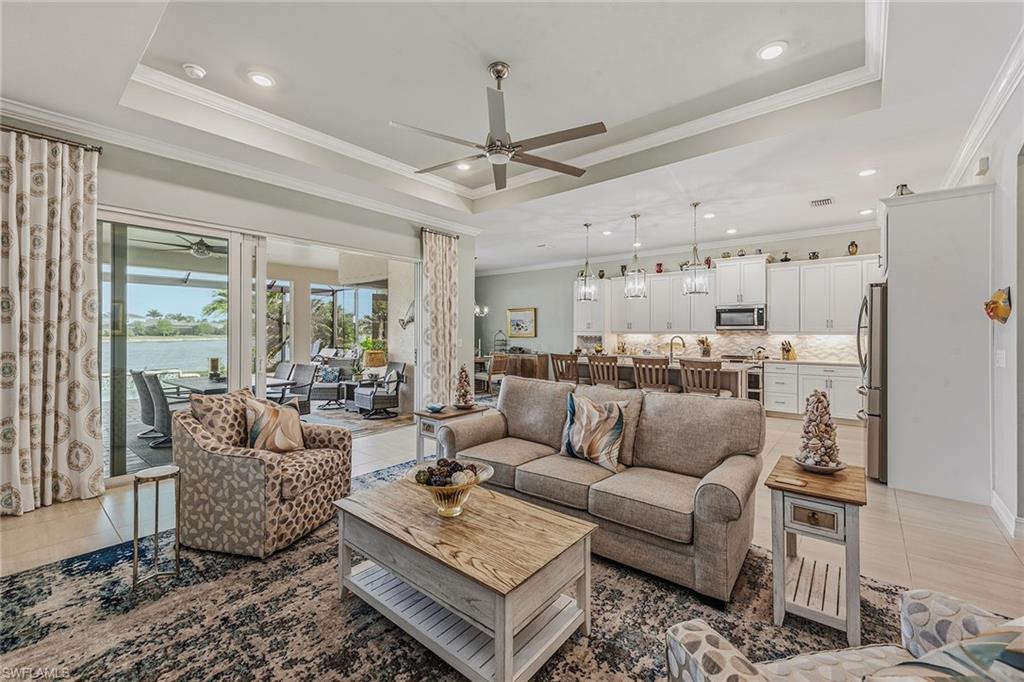 14685 Kelson Circle Naples, FL 34114 - Photo 4 of 50 a living room with furniture and a large window