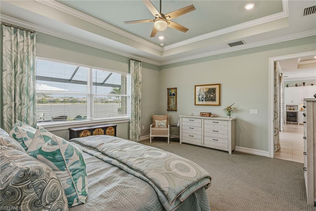 14685 Kelson Circle Naples, FL 34114 - Photo 8 of 50 a bedroom with a bed and a large window