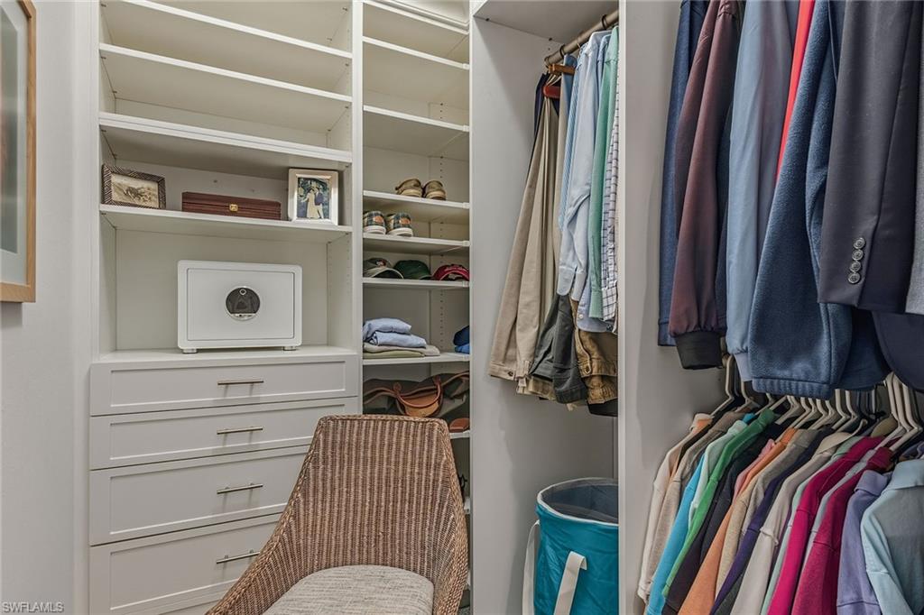 14685 Kelson Circle Naples, FL 34114 - Photo 10 of 50 a view of walk in closet with clothes and shoes