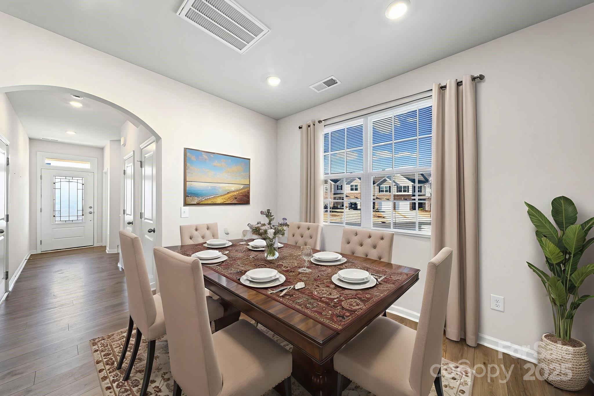5044 Moss Pine Way Tega Cay, SC 29708 - Photo 11 of 40 a view of a dining room with furniture and wooden floor
