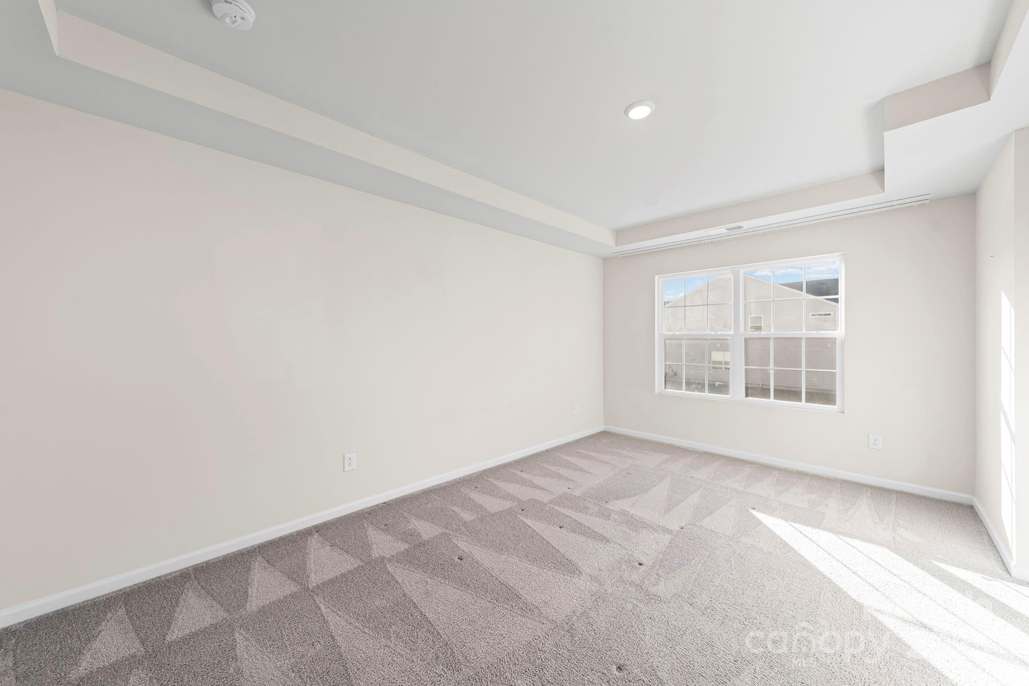 5044 Moss Pine Way Tega Cay, SC 29708 - Photo 21 of 40 a view of an empty room with a window