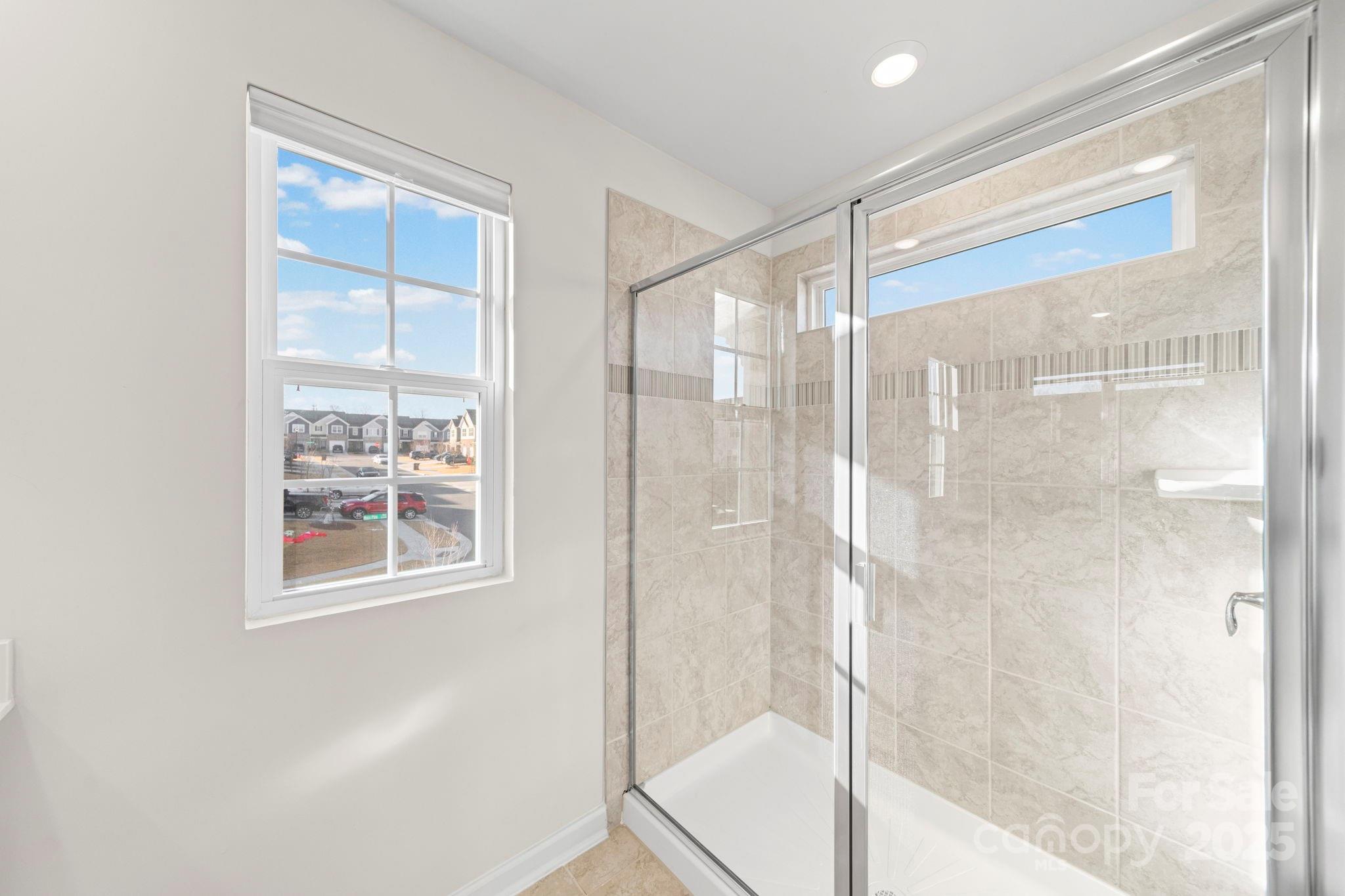 5044 Moss Pine Way Tega Cay, SC 29708 - Photo 24 of 40 a bathroom with a bathtub and shower