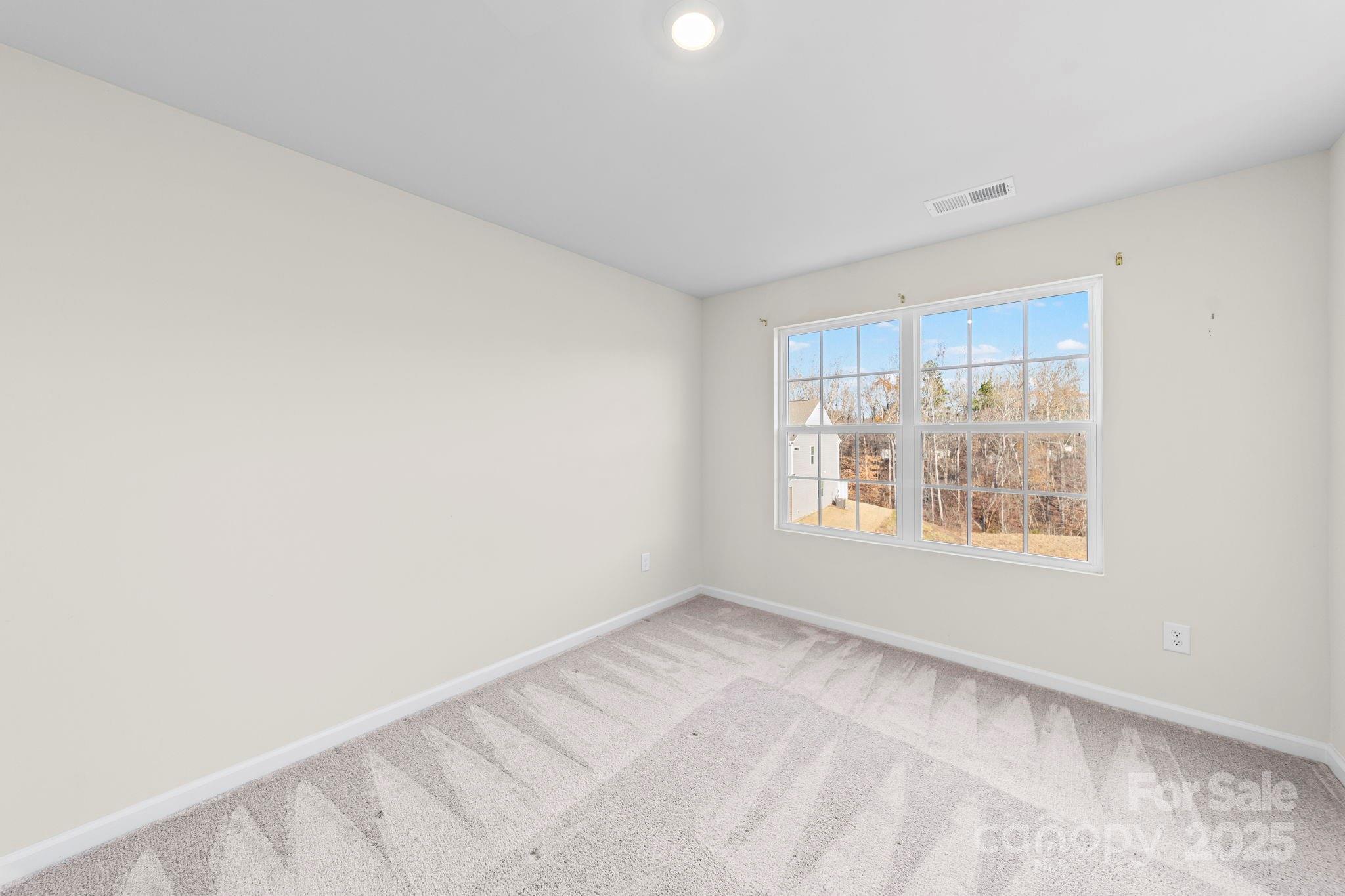 5044 Moss Pine Way Tega Cay, SC 29708 - Photo 31 of 40 a view of an empty room with a window