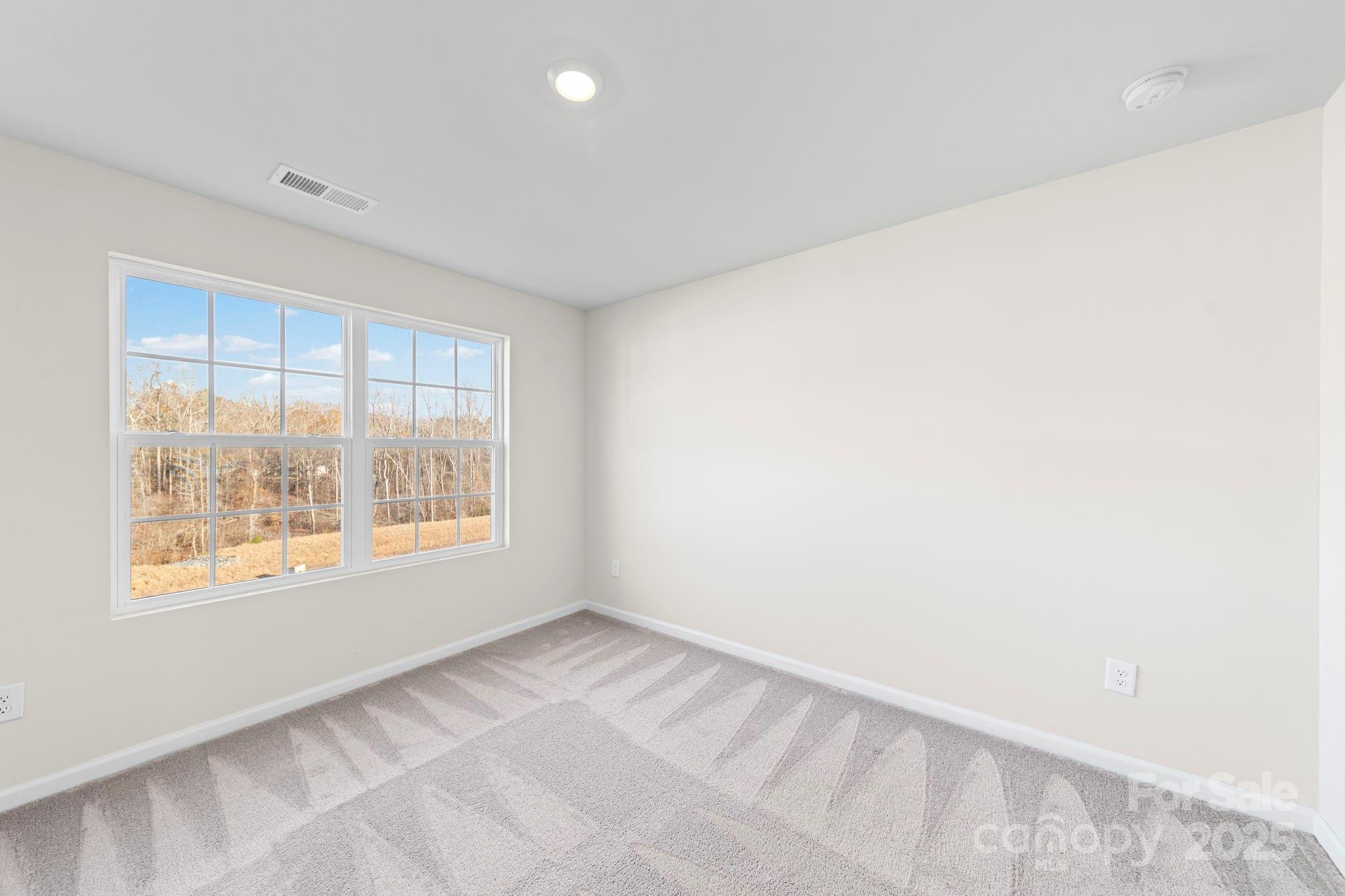 5044 Moss Pine Way Tega Cay, SC 29708 - Photo 33 of 40 a view of an empty room with a window