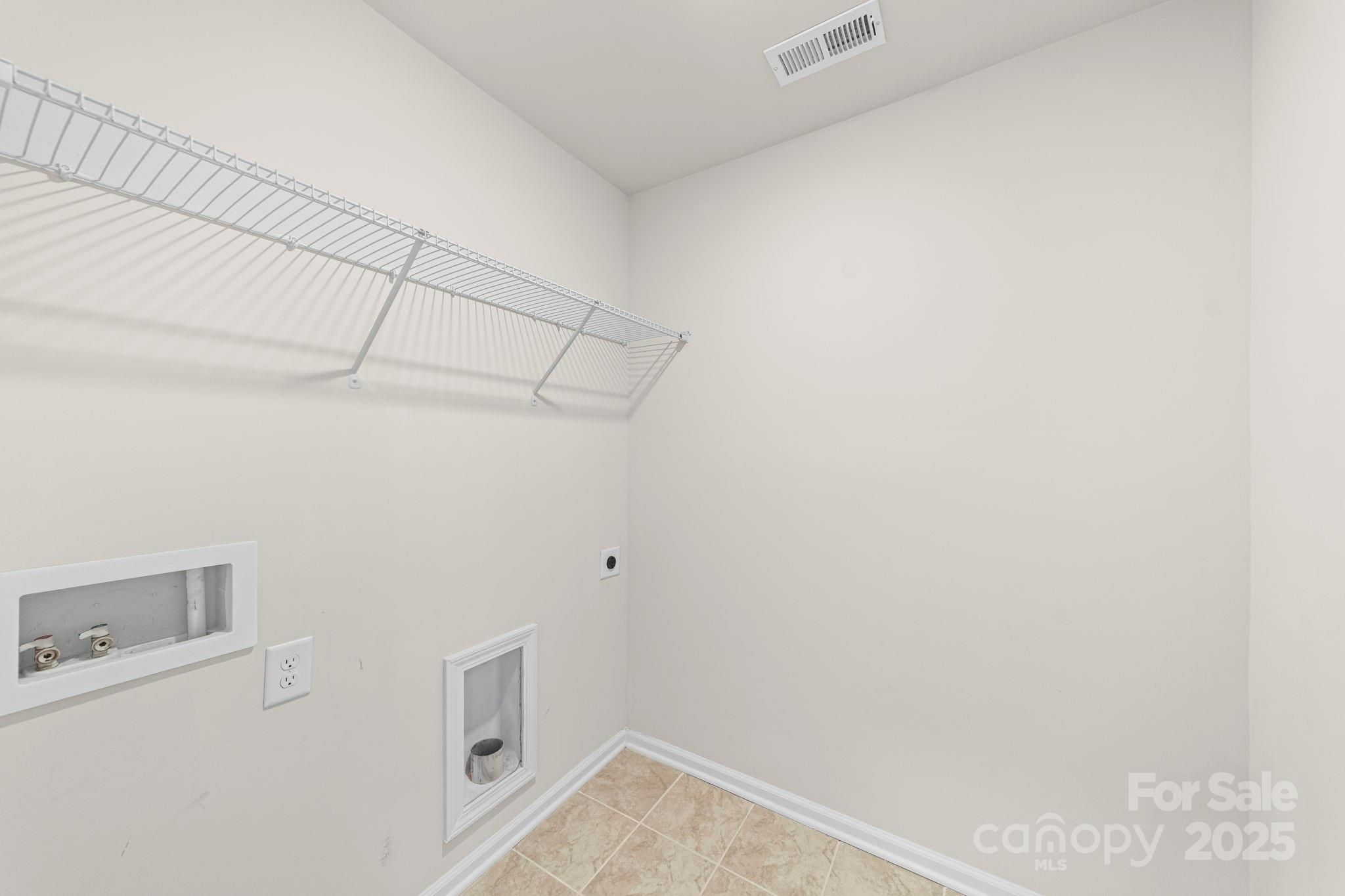 5044 Moss Pine Way Tega Cay, SC 29708 - Photo 34 of 40 a view of storage and utility room with empty racks